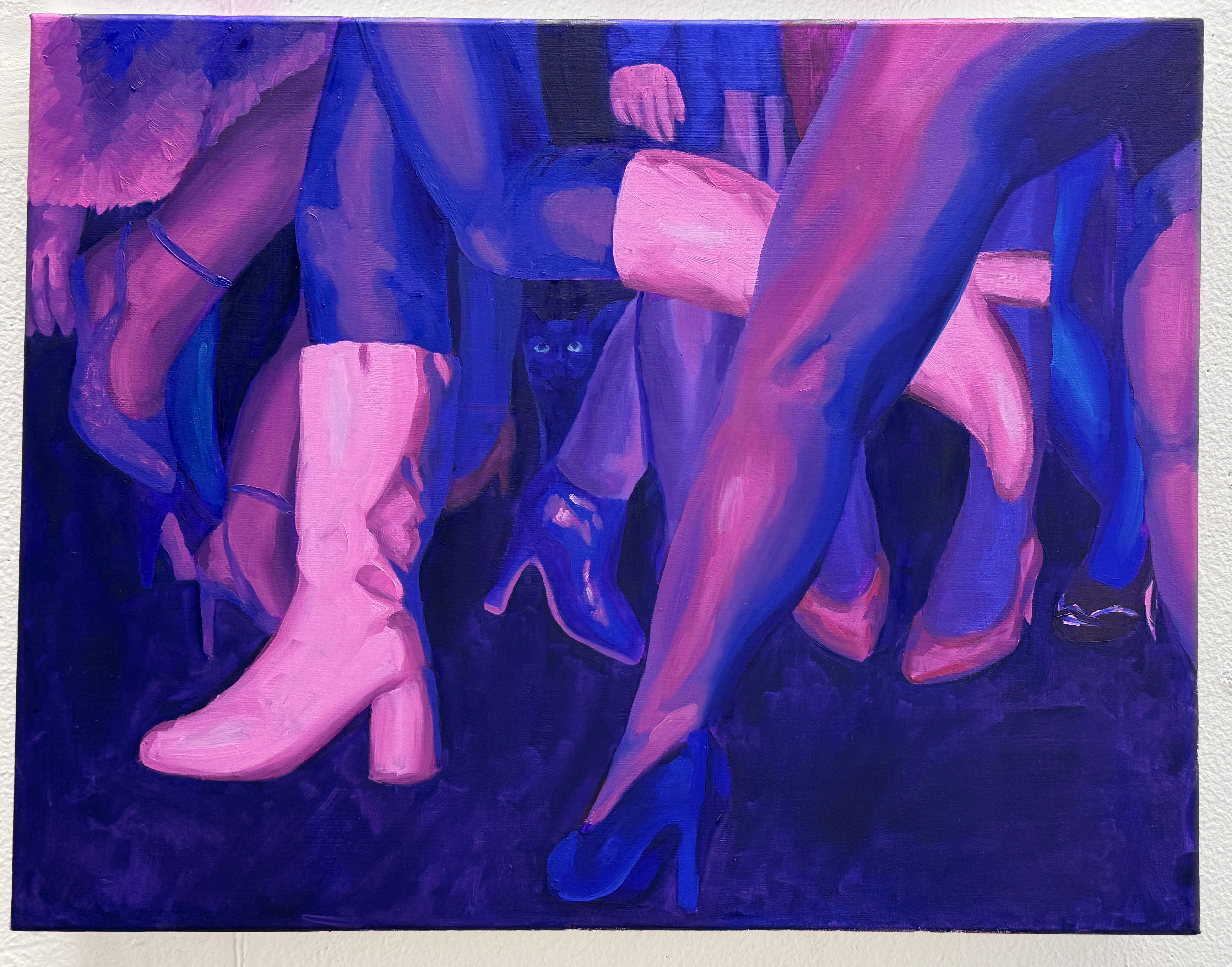 A painting made of the colors pink, blue, purple, and teal. It is a floor view of a party, a tangle of legs, through all the legs in the back you can see the faint silhouette and glowing eyes of a cat